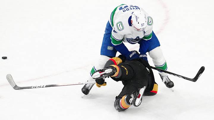 Feb 4, 2026; Las Vegas, Nevada, USA; Vancouver Canucks defenseman Tyler Myers (57) checks Vegas Golden Knights right wing Alexander Holtz (26) during the third period at T-Mobile Arena. Mandatory Credit: Stephen R. Sylvanie-Imagn Images Feb 4, 2026; Las Vegas, Nevada, USA; Vancouver Canucks defenseman Tyler Myers (57) checks Vegas Golden Knights right wing Alexander Holtz (26) during the third period at T-Mobile Arena. Mandatory Credit: Stephen R. Sylvanie-Imagn Images