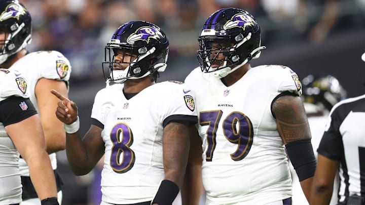 Sep 13, 2021; Paradise, Nevada, USA; Baltimore Ravens quarterback Lamar Jackson (8) and offensive tackle Ronnie Stanley (79) against the Las Vegas Raiders during Monday Night Football at Allegiant Stadium. Mandatory Credit: Mark J. Rebilas-Imagn Images