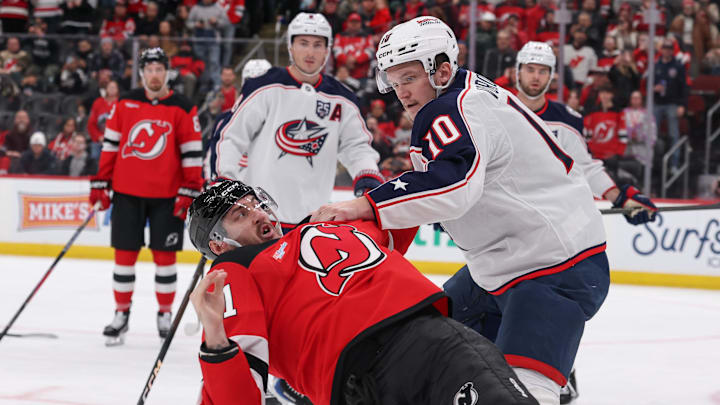 Columbus Blue Jackets left wing Dmitri Voronkov (10) and New Jersey Devils right wing Stefan Noesen (11) fight: Ed Mulholland-Imagn Images