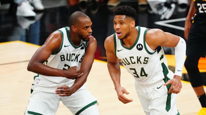 Jul 8, 2021; Phoenix, Arizona, USA; Milwaukee Bucks forward Giannis Antetokounmpo (34) and Khris Middleton (22) against the Phoenix Suns in game two of the 2021 NBA Finals at Phoenix Suns Arena. Mandatory Credit: Mark J. Rebilas-Imagn Images