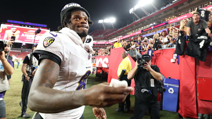 Oct 21, 2024; Tampa, Florida, USA; Baltimore Ravens quarterback Lamar Jackson (8) runs off the field after beating the Tampa Bay Buccaneers at Raymond James Stadium. Mandatory Credit: Nathan Ray Seebeck-Imagn Images