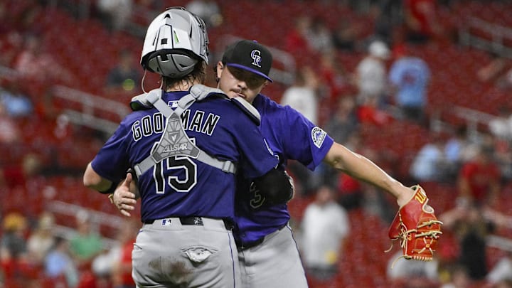 Aug 12, 2025; St. Louis, Missouri, USA;  Colorado Rockies relief pitcher Victor Vodnik (38) celebrates with catcher Hunter Goodman (15) after the Rockies defeated the St. Louis Cardinals at Busch Stadium.