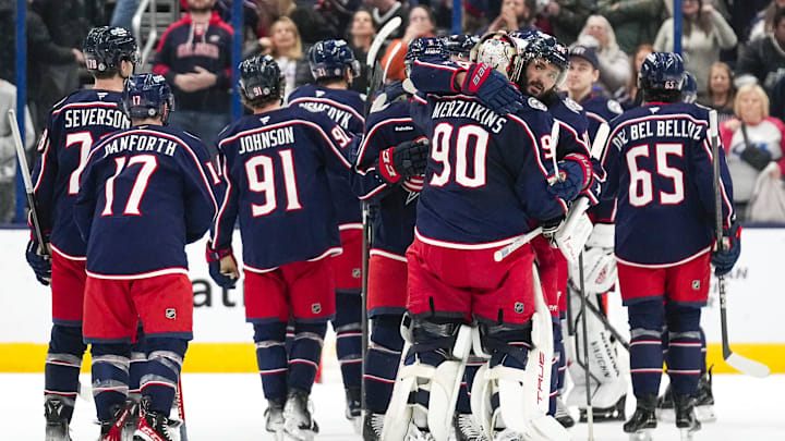 Jan 25, 2025; Columbus, Ohio, USA; Columbus Blue Jackets right wing Kirill Marchenko (86) hugs goaltender Elvis Merzlikins (90) after defeating Los Angeles Kings in overtime at Nationwide Arena on Saturday, Jan. 25, 2025 in Columbus, Ohio.   Mandatory Credit: Samantha Madar/USA TODAY Network via Imagn Images 