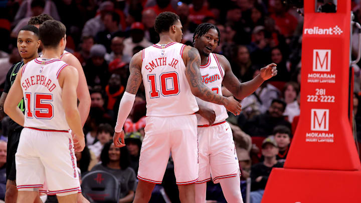 Jan 18, 2026; Houston, Texas, USA; Houston Rockets forward Dorian Finney-Smith (2) is congratulated by forward Jabari Smith Jr. (10) after a basket against the New Orleans Pelicans during the fourth quarter at Toyota Center. Mandatory Credit: Erik Williams-Imagn Images