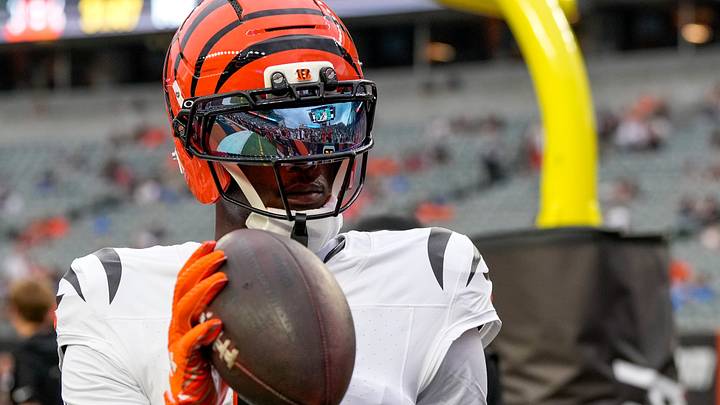 Cincinnati Bengals wide receiver Tee Higgins (5) throws a ball to a young fan during pregame before the first quarter of the NFL Preseason game between the Cincinnati Bengals and the Detroit Lions at Paycor Stadium in Cincinnati on Thursday, Aug. 13, 2026. Cincinnati Bengals wide receiver Tee Higgins (5) throws a ball to a young fan during pregame before the first quarter of the NFL Preseason game between the Cincinnati Bengals and the Detroit Lions at Paycor Stadium in Cincinnati on Thursday, Aug. 13, 2026.
