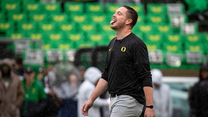 Oregon head coach Dan Lanning sticks his tongue out to catch the rain as the No. 6 Oregon Ducks host California Saturday, Nov. 4, 2023, at Autzen Stadium in Eugene, Ore.