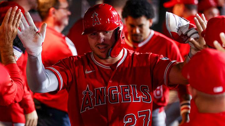 Sep 23, 2026; West Sacramento, California, USA;  Los Angeles Angels designated hitter Mike Trout (27) celebrates in the dugout with teammates after hitting a one run home run during the fourth inning against the Athletics at Sutter Health Park.  Mandatory Credit: Sergio Estrada-Imagn Images