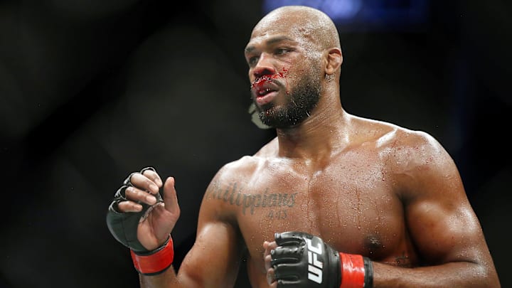 Feb 8, 2020; Houston, Texas, USA; Jon Jones (red gloves) fights Dominick Reyes (not pictured) during