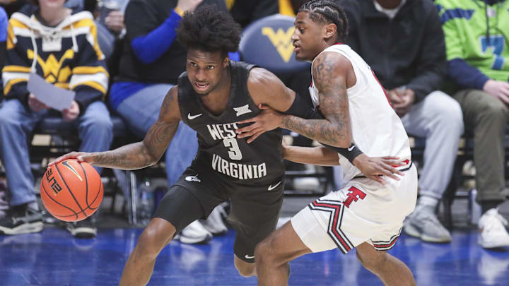 Feb 8, 2026; Morgantown, West Virginia, USA; West Virginia Mountaineers guard Honor Huff (3) dribbles against Texas Tech Red Raiders guard Jaylen Petty (11) during the first half at Hope Coliseum. Mandatory Credit: Ben Queen-Imagn Images