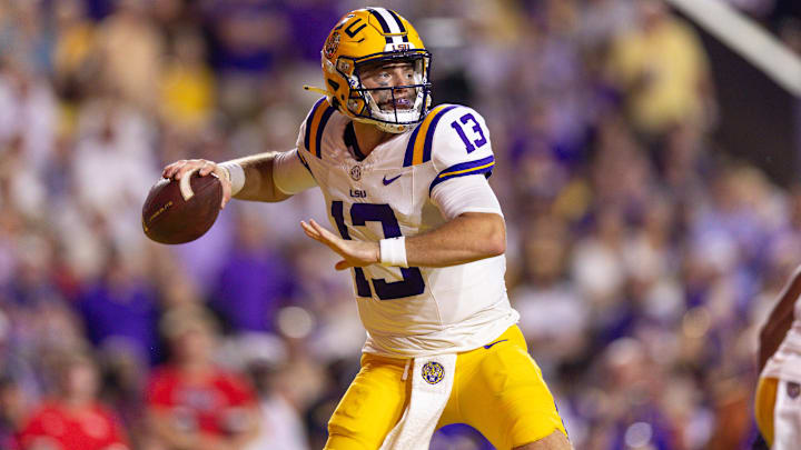 Oct 12, 2024; Baton Rouge, Louisiana, USA; LSU Tigers quarterback Garrett Nussmeier (13) drops back to pass against the Mississippi Rebels during the first half at Tiger Stadium. Mandatory Credit: Stephen Lew-Imagn Images Oct 12, 2024; Baton Rouge, Louisiana, USA; LSU Tigers quarterback Garrett Nussmeier (13) drops back to pass against the Mississippi Rebels during the first half at Tiger Stadium. Mandatory Credit: Stephen Lew-Imagn Images