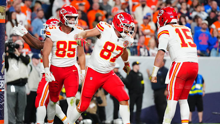 Nov 16, 2025; Denver, Colorado, USA; Kansas City Chiefs tight end Travis Kelce (87) celebrates his touchdown with quarterback Patrick Mahomes (15) and tight end Robert Tonyan (85) in the fourth quarter at Empower Field at Mile High. Mandatory Credit: Ron Chenoy-Imagn Images