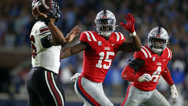 Nov 1, 2025; Oxford, Mississippi, USA; Mississippi Rebels defensive lineman Da'Shawn Womack (15) and Mississippi Rebels linebacker Suntarine Perkins (4) rush South Carolina Gamecocks quarterback LaNorris Sellers (16) during the fourth quarter at Vaught-Hemingway Stadium. Mandatory Credit: Petre Thomas-Imagn Images