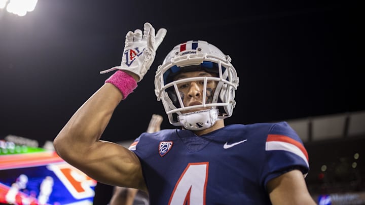 Oct 1, 2022; Tucson, Arizona, USA; Arizona Wildcats wide receiver Tetairoa McMillan (4) celebrates after scoring a touchdown against the Colorado Buffaloes in the first half at Arizona Stadium. Mandatory Credit: Ivan Pierre Aguirre-Imagn Images