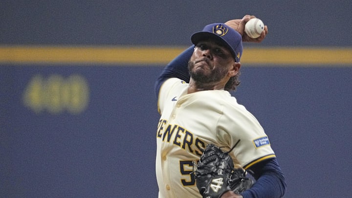 Oct 14, 2025; Milwaukee, Wisconsin, USA; Milwaukee Brewers pitcher Freddy Peralta (51) throws pitch against the Los Angeles Dodgers in the first inning during game two of the NLCS round for the 2025 MLB playoffs at American Family Field. Mandatory Credit: Michael McLoone-Imagn Images