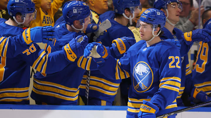 Jan 11, 2025; Buffalo, New York, USA;  Buffalo Sabres right wing Jack Quinn (22) celebrates his goal with teammates during the first period against the Seattle Kraken at KeyBank Center. Mandatory Credit: Timothy T. Ludwig-Imagn Images