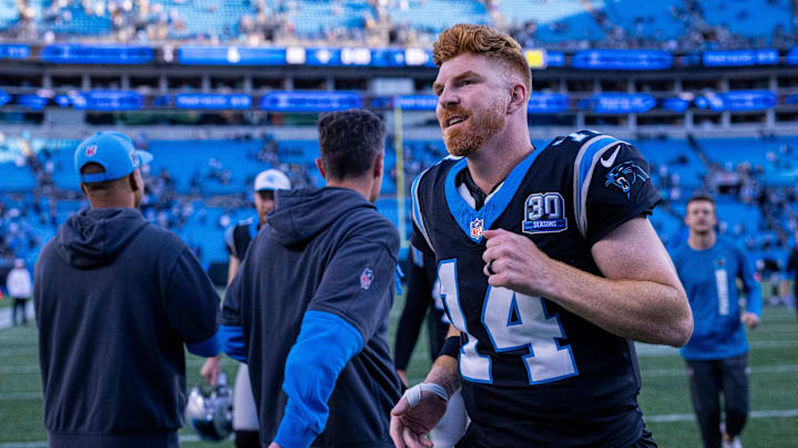 Nov 3, 2024; Charlotte, North Carolina, USA; Carolina Panthers quarterback Andy Dalton (14) runs off after defeating the New Orleans Saints at Bank of America Stadium. Mandatory Credit: Scott Kinser-Imagn Images