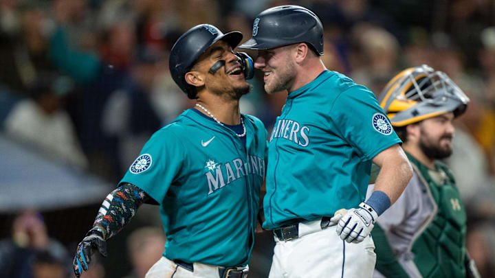 Seattle Mariners first baseman Luke Raley (right) celebrates with center fielder Julio Rodriguez after hitting a home run against the Oakland Athletics on Saturday at T-Mobile Park.