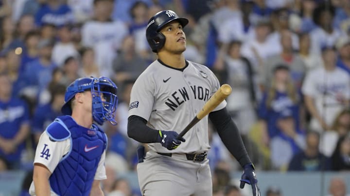 Oct 26, 2024; Los Angeles, California, USA; New York Yankees outfielder Juan Soto (22) hits a solo home run in the third inning against the Los Angeles Dodgers during game two of the 2024 MLB World Series at Dodger Stadium.
