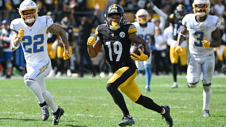 Sep 22, 2024; Pittsburgh, Pennsylvania, USA; Pittsburgh Steelers wide receiver Calvin Austin III (19) scores a touchdown while being chased by Los Angeles Chargers cornerback Elijah Molden (22) during the fourth quarter at Acrisure Stadium. Mandatory Credit: Barry Reeger-Imagn Images