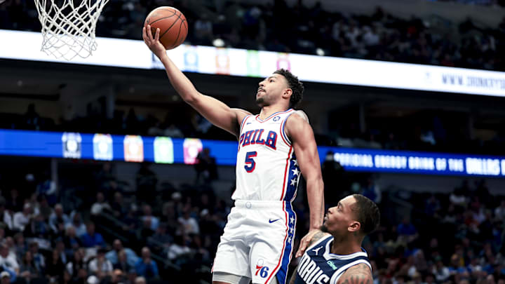 Mar 16, 2025; Dallas, Texas, USA;  Philadelphia 76ers guard Quentin Grimes (5) shoots past Dallas Mavericks forward P.J. Washington (25) during the second half at American Airlines Center. Mandatory Credit: Kevin Jairaj-Imagn Images