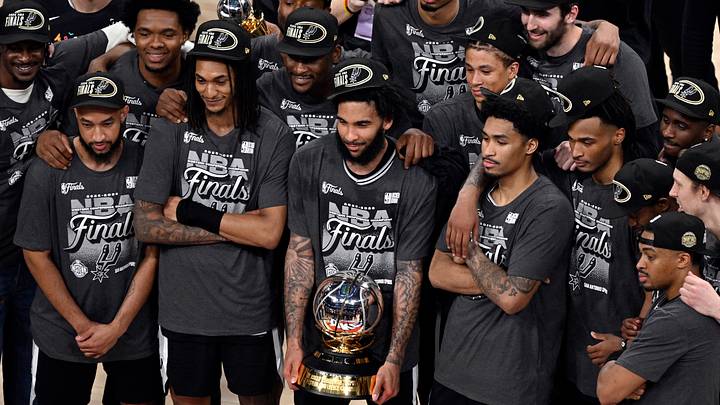 May 30, 2026; Oklahoma City, Oklahoma, USA; San Antonio Spurs forward Julian Champagnie (30) and teammates celebrate with the Oscar Robertson trophy after defeating the Oklahoma City Thunder in game seven of the western conference finals for the 2026 NBA playoffs at Paycom Center. Mandatory Credit: Jerome Miron-Imagn Images