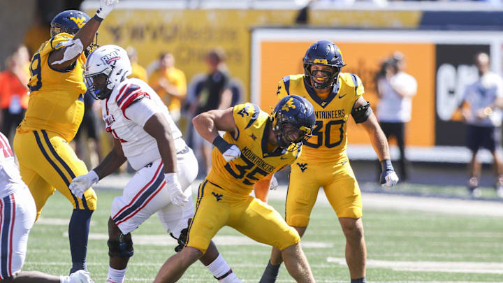 Aug 30, 2025; Morgantown, West Virginia, USA; West Virginia Mountaineers linebacker Reid Carrico (35) celebrates after a defensive stop during the second quarter against the Robert Morris Colonials at Milan Puskar Stadium. Mandatory Credit: Ben Queen-Imagn Images