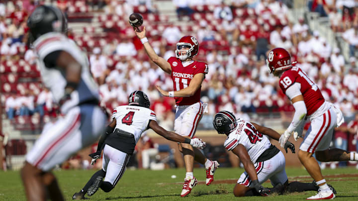 Oklahoma Sooners quarterback Jackson Arnold throws as South Carolina Gamecocks defensive back Vicari Swain rushes during the second half at Gaylord Family-Oklahoma Memorial Stadium. 