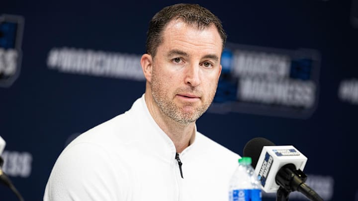 Mar 21, 2024; Indianapolis, IN, USA; Utah State Aggies head coach Danny Sprinkle talks to the media during the practice day at Gainbridge FieldHouse. Mandatory Credit: Trevor Ruszkowski-Imagn Images