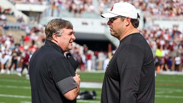 Nov 8, 2025; Starkville, Mississippi, USA; Georgia Bulldogs head coach Kirby Smart and Mississippi State Bulldogs head coach Jeff Lebby talk before the game at Davis Wade Stadium at Scott Field. Mandatory Credit: Wesley Hale-Imagn Images