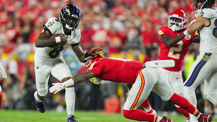 Sep 5, 2024; Kansas City, Missouri, USA; Baltimore Ravens quarterback Lamar Jackson (8) runs the ball against Kansas City Chiefs safety Bryan Cook (6) during the second half at GEHA Field at Arrowhead Stadium. Mandatory Credit: Jay Biggerstaff-Imagn Images Sep 5, 2024; Kansas City, Missouri, USA; Baltimore Ravens quarterback Lamar Jackson (8) runs the ball against Kansas City Chiefs safety Bryan Cook (6) during the second half at GEHA Field at Arrowhead Stadium. Mandatory Credit: Jay Biggerstaff-Imagn Images