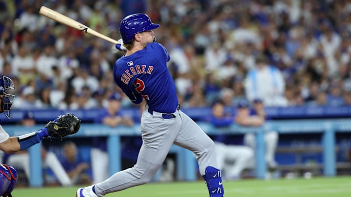 Sep 10, 2024; Los Angeles, California, USA;  Chicago Cubs second baseman Nico Hoerner (2) hits a single during the seventh inning against the Los Angeles Dodgers at Dodger Stadium. Mandatory Credit: Kiyoshi Mio-Imagn Images
