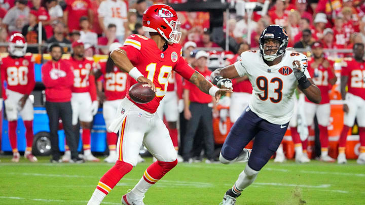 Aug 22, 2025; Kansas City, Missouri, USA; Kansas City Chiefs quarterback Chris Oladokun (19) throws a pass as Chicago Bears defensive end Xavier Carlton (93) defends during the second half of the game at GEHA Field at Arrowhead Stadium. Mandatory Credit: Denny Medley-Imagn Images