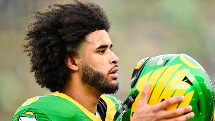 Dec 20, 2025; Eugene, OR, USA; Oregon Ducks quarterback Dante Moore (5) looks on before the game against the James Madison Dukes at Autzen Stadium. Mandatory Credit: Troy Wayrynen-Imagn Images