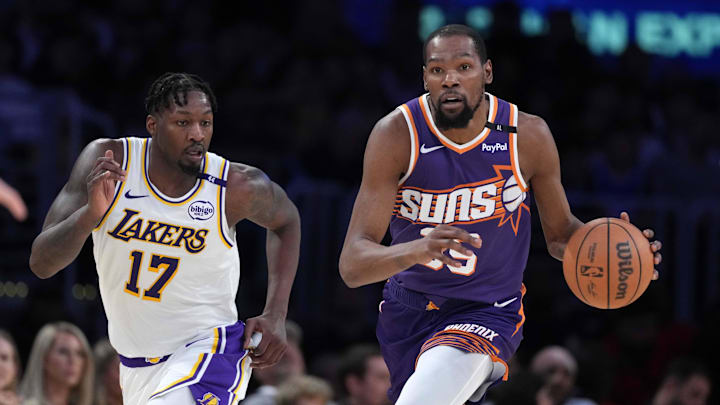 Mar 16, 2025; Los Angeles, California, USA; Phoenix Suns forward Kevin Durant (35) dribbles the ball against Los Angeles Lakers forward Dorian Finney-Smith (17) in the second half at Crypto.com Arena. Mandatory Credit: Kirby Lee-Imagn Images