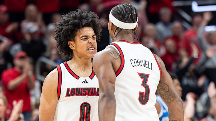 Louisville Cardinals guard Mikel Brown Jr. (0) and guard Ryan Conwell (3) celebrated after a score during first half action as the Louisville Cardinals hosted the Kentucky Wildcats at the KFC Yum! Center on Tuesday, Nov. 11, 2025. Louisville Cardinals guard Mikel Brown Jr. (0) and guard Ryan Conwell (3) celebrated after a score during first half action as the Louisville Cardinals hosted the Kentucky Wildcats at the KFC Yum! Center on Tuesday, Nov. 11, 2025.
