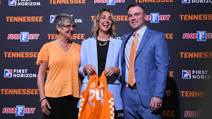 Kim Caldwell stands with her mother Linda Stephens and husband Justin Caldwell after being introduced as the new Lady Vols basketball coach in Knoxville, Tuesday, April 9, 2024.