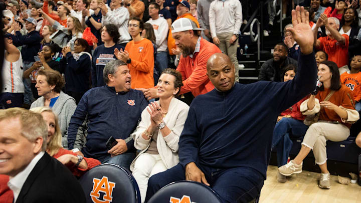 Former Auburn basketball player Charles Barkley acknowledges the crowd as Auburn Tigers take on USC Trojans at Neville Arena in Auburn, Ala., on Sunday, Dec. 17, 2023.