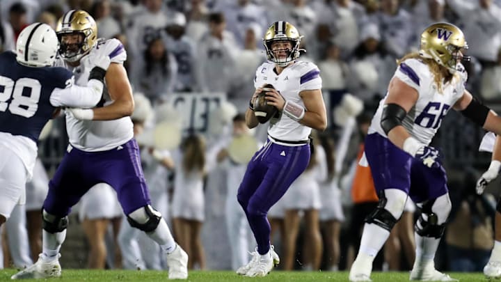 Nov 9, 2024; University Park, Pennsylvania, USA; Washington Huskies quarterback Will Rogers (7) drops back to throw a pass against the Penn State Nittany Lions during the first quarter at Beaver Stadium. Penn State won 35-6. Mandatory Credit: Matthew O'Haren-Imagn Images