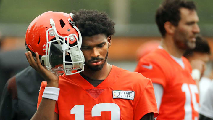 Shedeur Sanders listens to a playcall before Browns practice.
