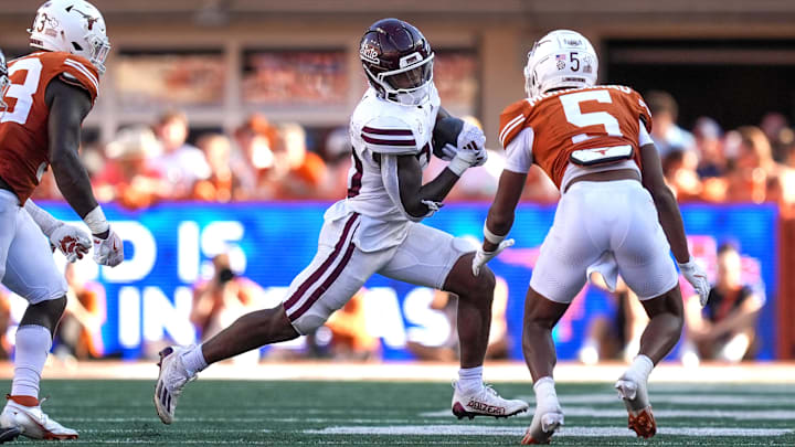 Mississippi State Bulldogs running back Johnnie Daniels (20) runs in front of Texas Longhorns defensive back Malik Muhammad (5) in the second half at Darrell K Royal-Texas Memorial Stadium. Mississippi State Bulldogs running back Johnnie Daniels (20) runs in front of Texas Longhorns defensive back Malik Muhammad (5) in the second half at Darrell K Royal-Texas Memorial Stadium.