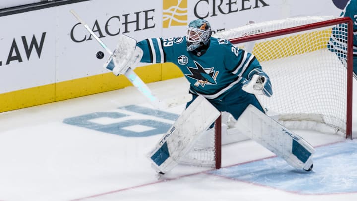 Nov 23, 2024; San Jose, California, USA; San Jose Sharks goaltender Mackenzie Blackwood (29) deflects a shot by a Buffalo Sabres player during the third period at SAP Center in San Jose. Mandatory Credit: John Hefti-Imagn Images