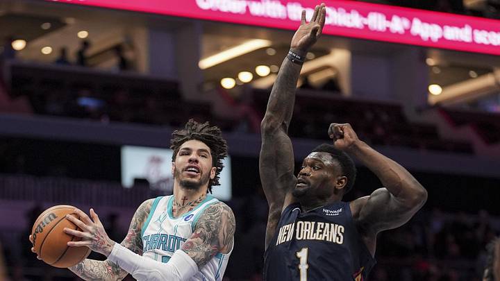 Charlotte Hornets guard LaMelo Ball (1) drives to the basket against New Orleans Pelicans forward Zion Williamson 