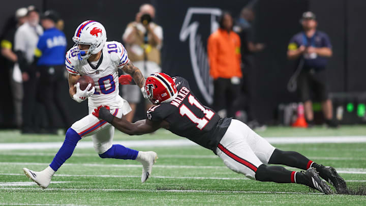 Oct 13, 2025; Atlanta, Georgia, USA; Buffalo Bills wide receiver Khalil Shakir (10) attempts to break the tackle of Atlanta Falcons defensive end Jalon Walker (11).