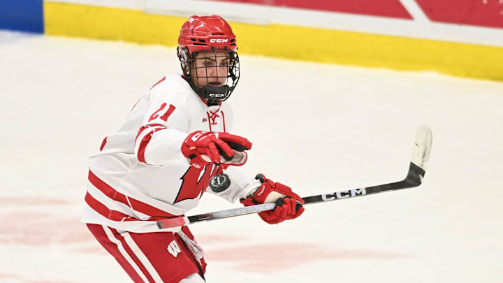 Wisconsin defender Emma Venusio (21) plucks a puck out of the air in a game against Ohio State on Sunday, February 8, 2026, at LaBahn Arena in Madison, Wisconsin.