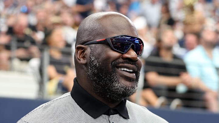 Sep 15, 2024; Arlington, Texas, USA; Former NBA player Shaquille O'Neal stands on the sidelines before a game between the New Orleans Saints and Dallas Cowboys at AT&T Stadium. 