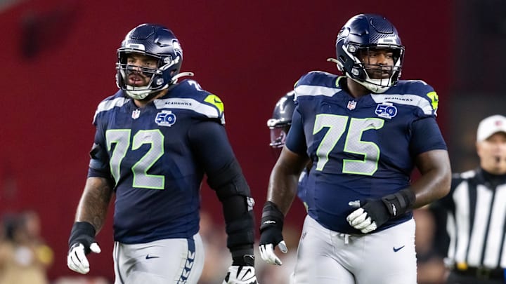 Sep 25, 2025; Glendale, Arizona, USA; Seattle Seahawks tackle Abraham Lucas (72) and guard Anthony Bradford (75) against the Arizona Cardinals at State Farm Stadium.