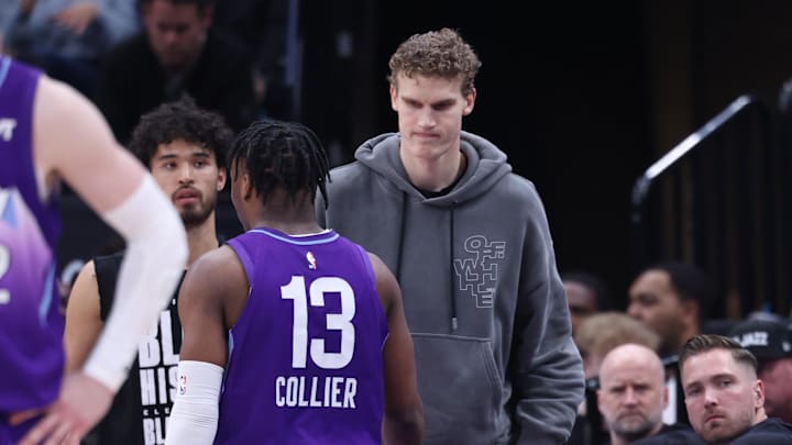 Feb 24, 2025; Salt Lake City, Utah, USA; Utah Jazz forward Lauri Markkanen (right) slaps hands with guard Isaiah Collier (13) during the second half of the game against the Portland Trail Blazers at Delta Center. Mandatory Credit: Rob Gray-Imagn Images