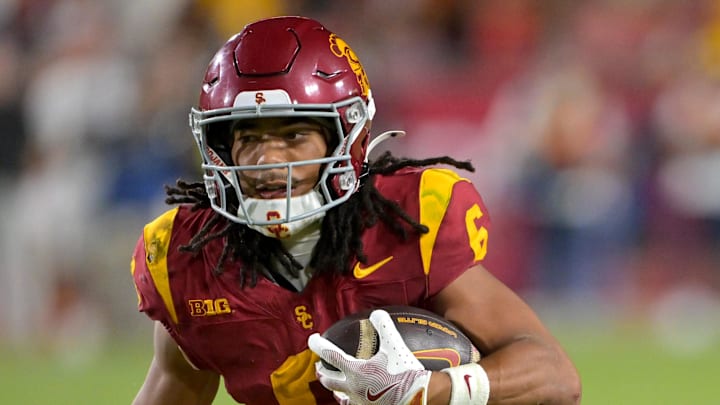 Oct 11, 2025; Los Angeles, California, USA; USC Trojans wide receiver Makai Lemon (6) takes the ball on a kickoff return in the second half against the Michigan Wolverines at United Airlines Field at the Los Angeles Memorial Coliseum. Mandatory Credit: Jayne Kamin-Oncea-Imagn Images