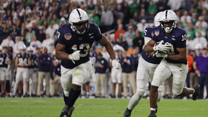 Penn State Nittany Lions running back Nicholas Singleton (10) runs the ball behind Kaytron Allen for a touchdown in the Orange Bowl vs. Notre Dame.