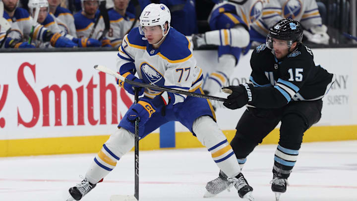 Mar 20, 2025; Salt Lake City, Utah, USA; Buffalo Sabres right wing JJ Peterka (77) skates against Utah Hockey Club center Alexander Kerfoot (15) during the third period at Delta Center. Mandatory Credit: Rob Gray-Imagn Images